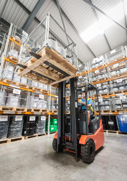 Forklift truck in warehouse